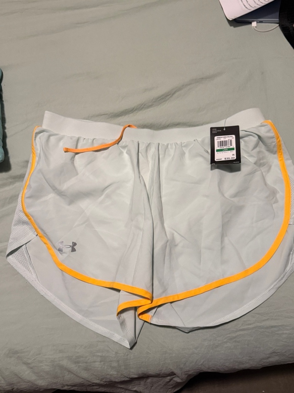 Under Armour Women’s Light Gray Athletic Shorts with Yellow Trim